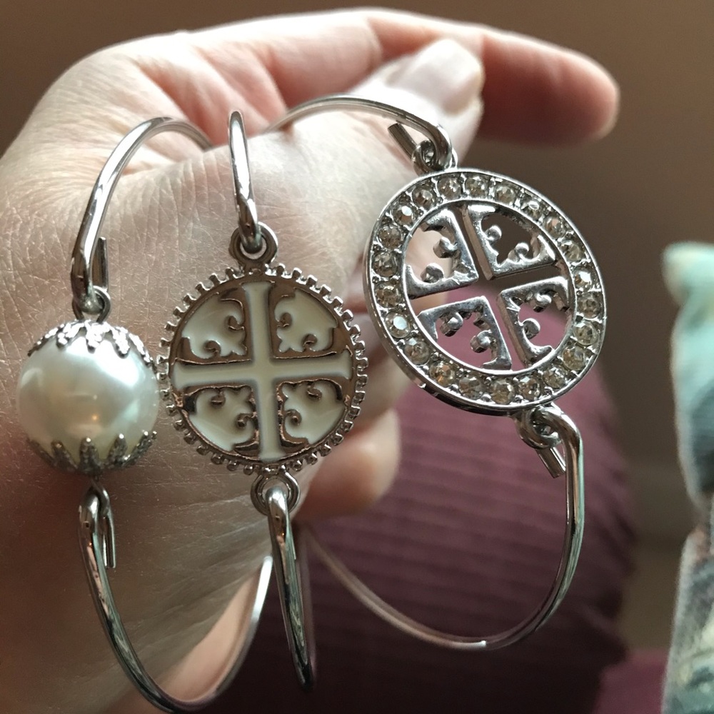 Bangle bracelets in a set of three in silver tone rhinestones, and faux pearl